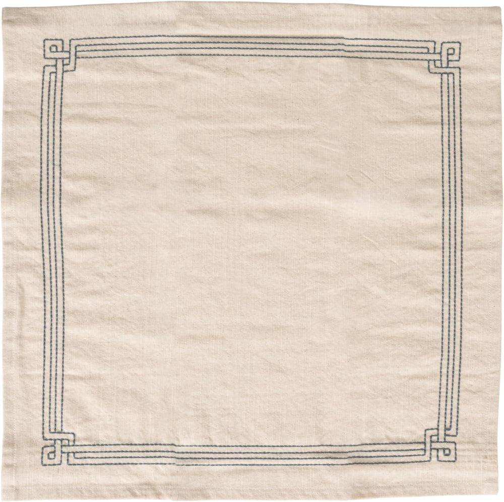 Beige rug with a decorative black border