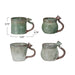 Four green ceramic mugs with handles on a white background, showing measurements.
