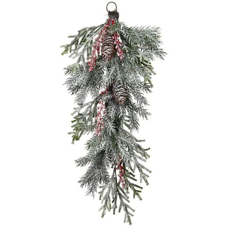 Artificial Christmas garland with green pine branches, red berries, and pink ribbons on a white background.