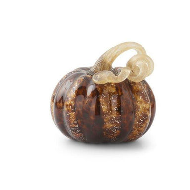 Glass pumpkin charm with a bow on a white background