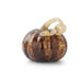 Glass pumpkin charm with a bow on a white background