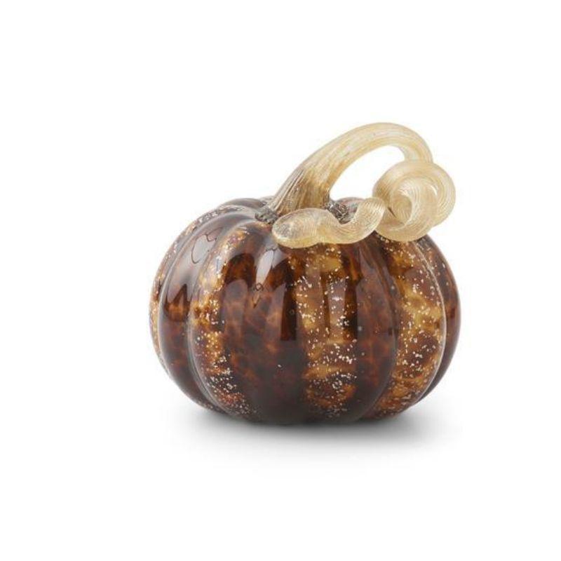 Glass pumpkin charm with a bow on a white background