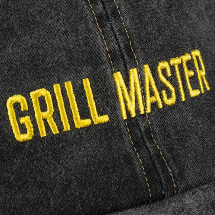 dark denim cap with yellow embroidery that reads Grill Master