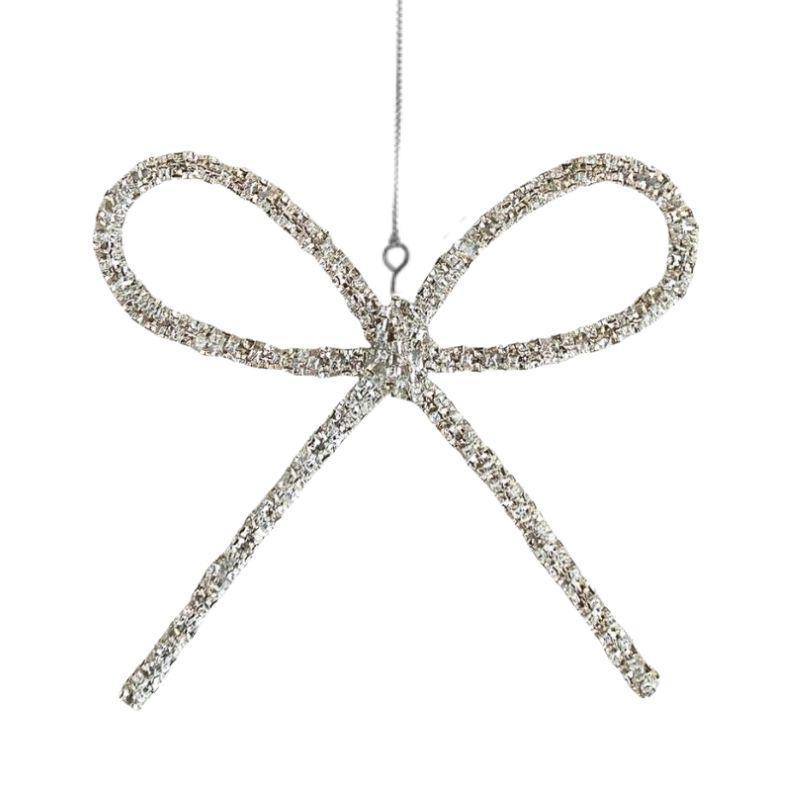 Decorative bow ornament with rhinestones on a white background