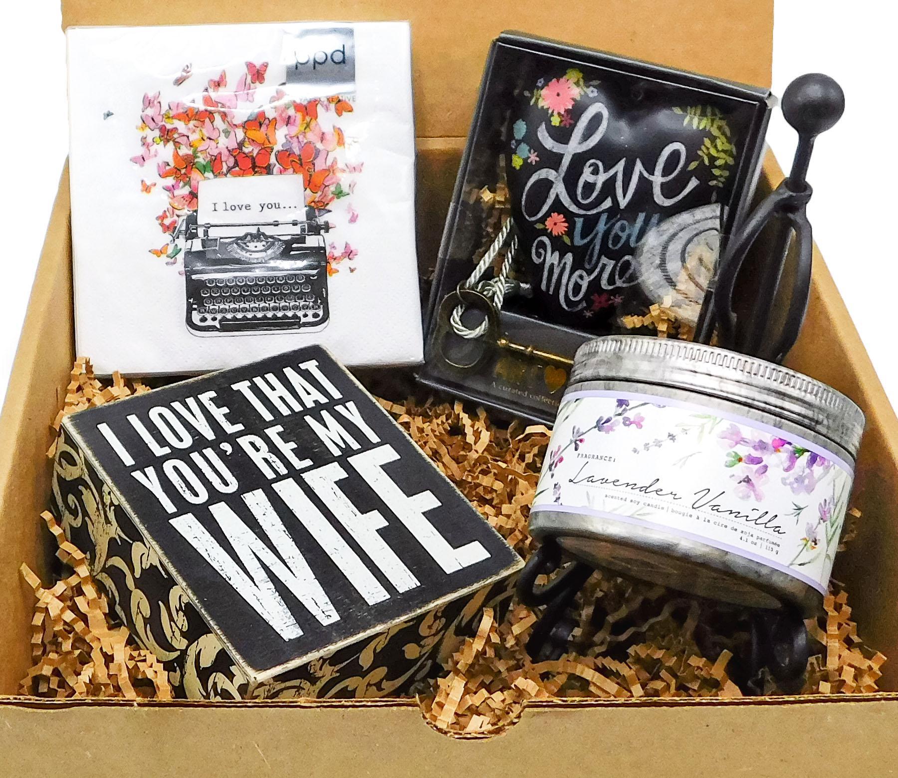 Gift box  filled with a wonderfully scented candle, a heartwarming box sign proclaiming your love, and a beautiful art heart figurine