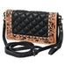 Black quilted leather crossbody bag with tan floral tooled leather borders, featuring a long adjustable black strap and dark metal hardware, shown on a plain white background.