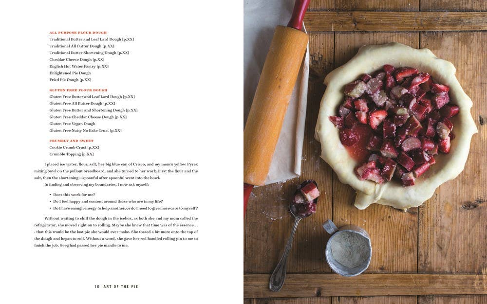 Pie with rhubarb filling on a wooden table with a rolling pin and measuring cup.