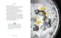 Dessert with blueberries and flowers on a plate next to a recipe text.