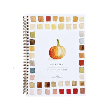 A spiral-bound watercolor workbook titled 'AUTUMN' with a watercolor pumpkin illustration in the center and a border of autumn watercolor swatches around the edges, shown on a white background.