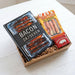 Gift set with 'Bacon 24/Seven' book and bacon-themed items on a white surface