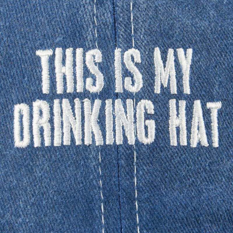 Blue denim fabric with white embroidered text 'THIS IS MY DRINKING HAT'