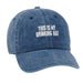 Blue denim cap with 'THIS IS MY DRINKING HAT' text on a white background