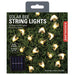 Packaging of solar bee string lights with Kikkerland branding on a grass background.