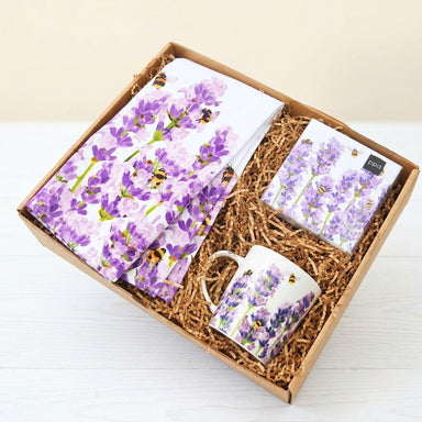 Gift set with a mug, tea towel, and tea bags featuring purple floral design.