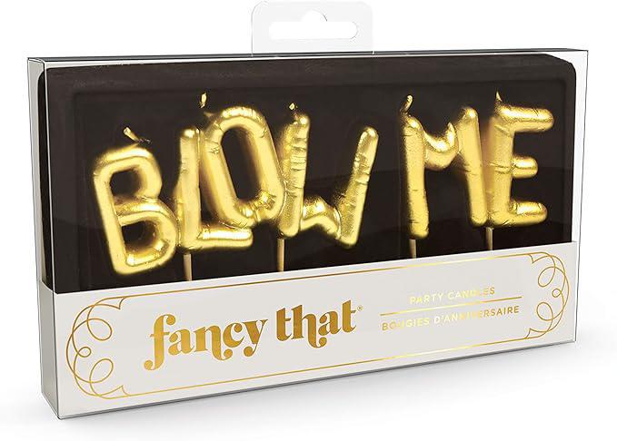 Gold 'BLOW ME' party candles in packaging with 'fancy that' branding.