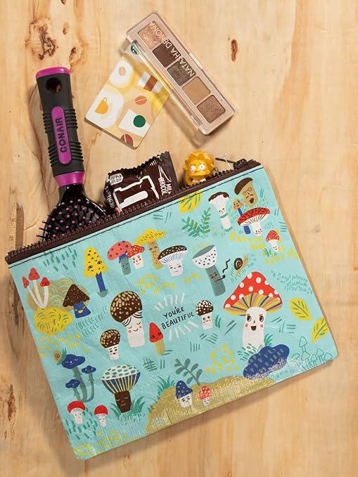 Makeup bag with mushroom design on a wooden surface