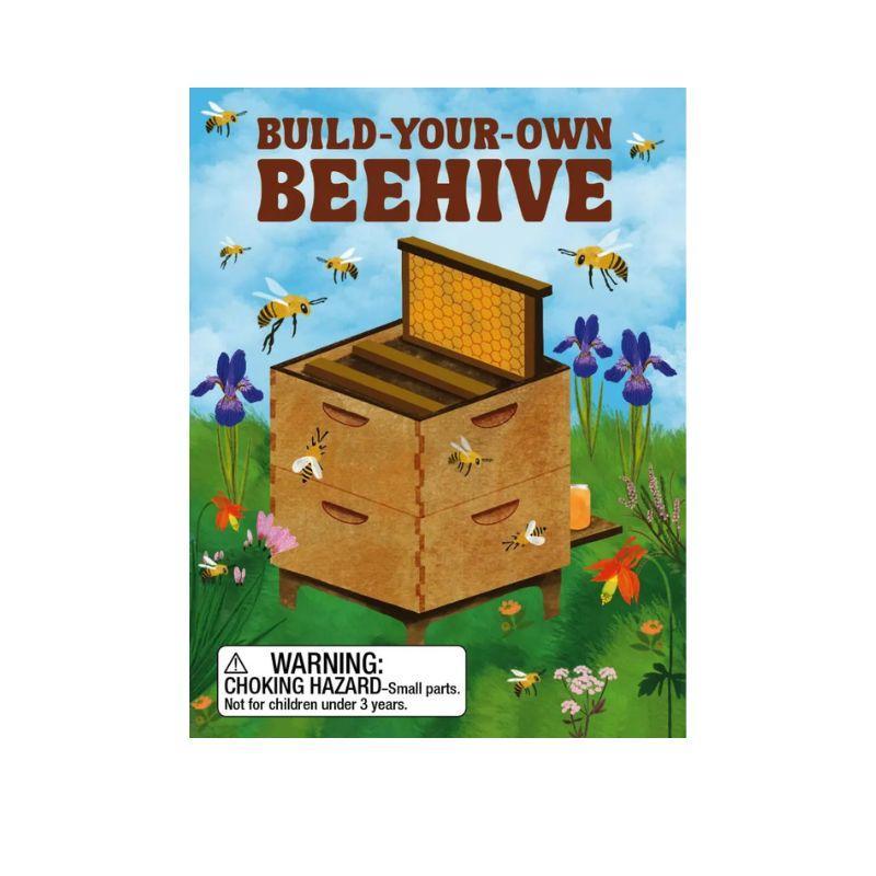 Build-your-own beehive kit packaging with bees and flowers on a blue background