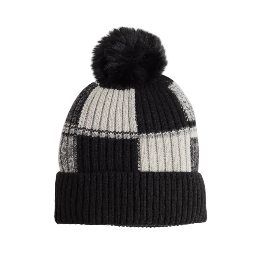 A black and gray checkered knit beanie with a fluffy black pom-pom, shown against a light gray background.