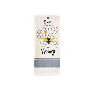Kitchen towel with bee and honeycomb design on a white background