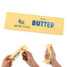 Butter stick with '4 oz. Salted Butter' text held by hands on a white background