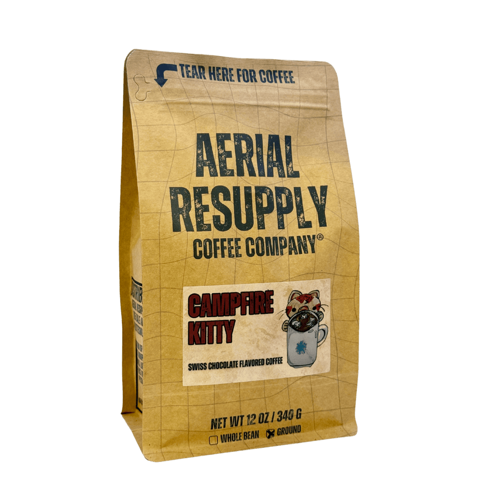 A 12 oz bag of Aerial Resupply Coffee Company Campfire Kitty whole bean coffee, featuring a tan grid-patterned bag with dark green and red text.