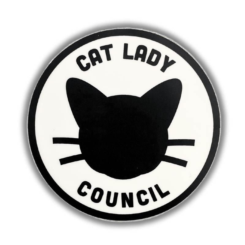 A circular white sticker or patch featuring a black cat silhouette and the text 'CAT LADY COUNCIL' in black, shown on a white background with a soft drop shadow.