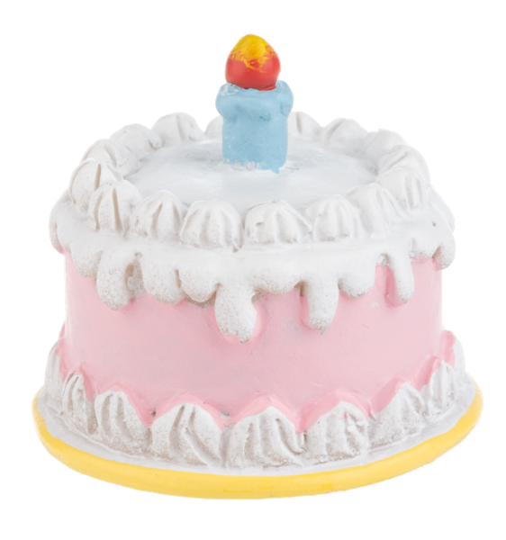 Toy birthday cake with white frosting and a colorful candle on a white background