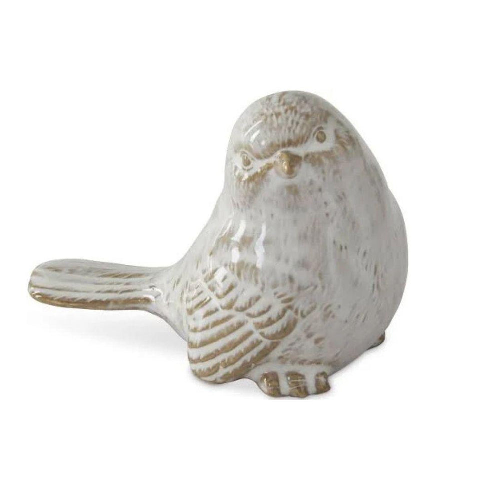 Ceramic bird figurine on a white background