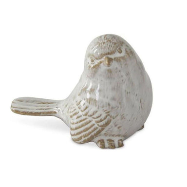 Ceramic bird figurine on a white background
