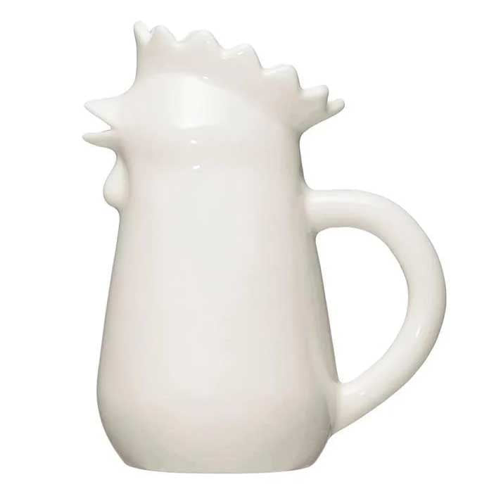 a white ceramic chicken shaped small pitcher.