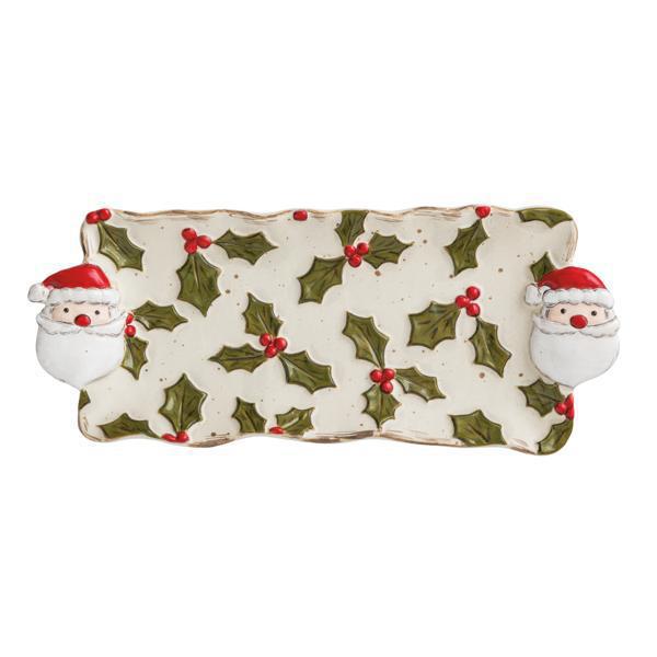 Decorative plate with Santa Claus faces and holly design on a white background