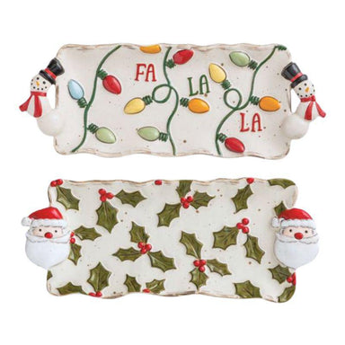 Two Christmas-themed cookie trays with snowmen and lights design on a white background