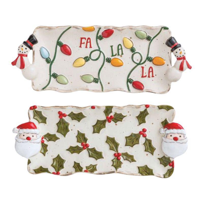 Two Christmas-themed cookie trays with snowmen and lights design on a white background