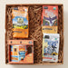 Gift box with coffee packages and a mug on a beige background