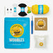 Crochet kit with 'The Woobles' branding on a white background