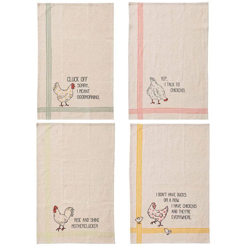 Four kitchen towels with chicken illustrations and humorous text on a white background