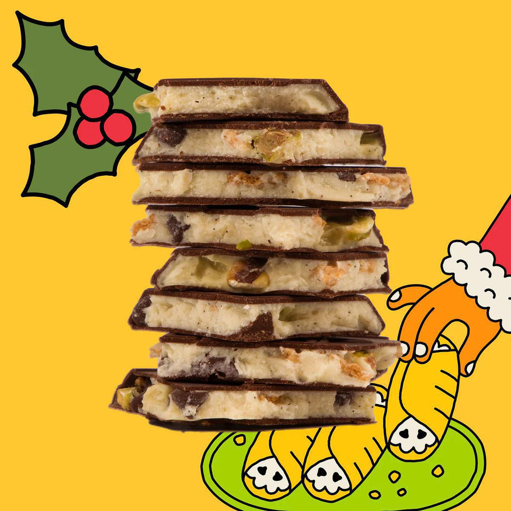 Stack of chocolate-covered treats with a holly leaf and Santa Claus illustration on a yellow background