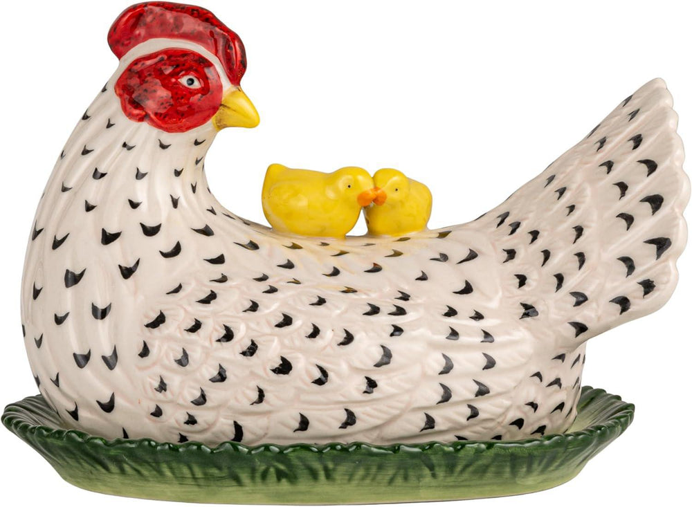 Ceramic chicken-shaped container with chicks on a white background