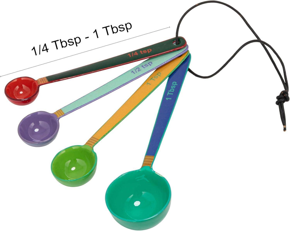 Set of colorful measuring spoons with a string on a white background