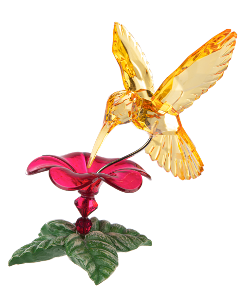 Glass hummingbird figurine on a pink flower with green leaves on a white background