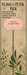 Decorative plant stake with pink sign and floral design on a brown background