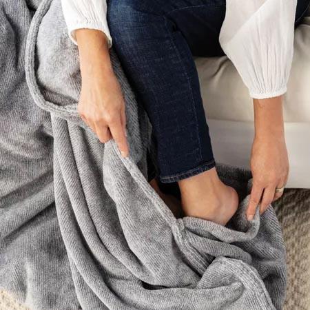 gray color big blanket with foot pockets 