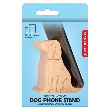 A Kikkerland Beechwood Dog Phone Stand in light natural wood, shown inside its blue retail packaging with a smartphone illustration.