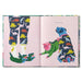 Open book with illustrations of dogs and dinosaurs on a pink background