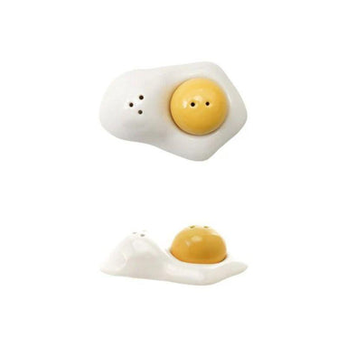 Salt and pepper shakers shaped like fried eggs on a white background