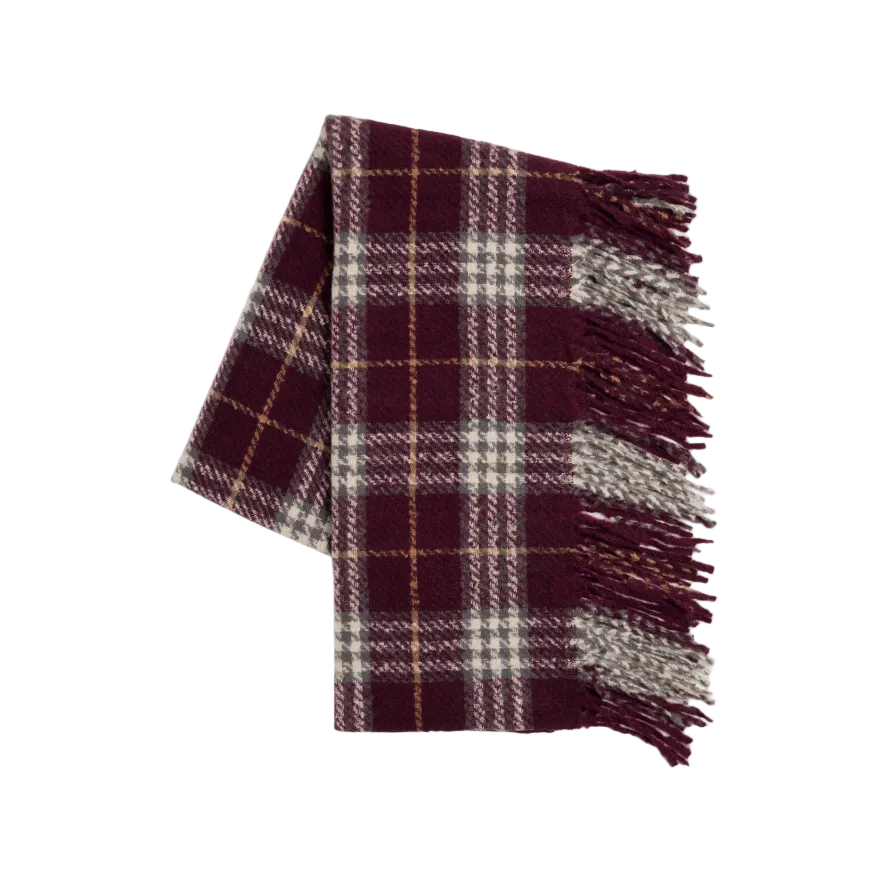 A folded plaid scarf in deep burgundy with cream and thin tan stripes, finished with fringed ends, shown on a light gray background.