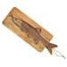 Wooden cutting board with engraved fish design on a white background