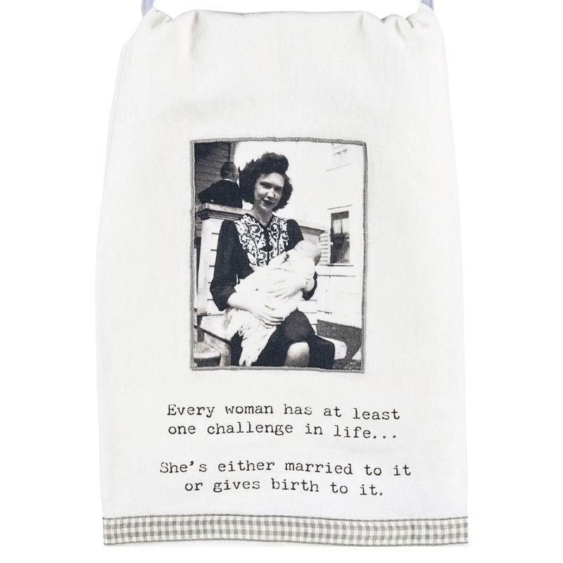 Towel with a black and white photo of a woman holding a baby and text on a white background