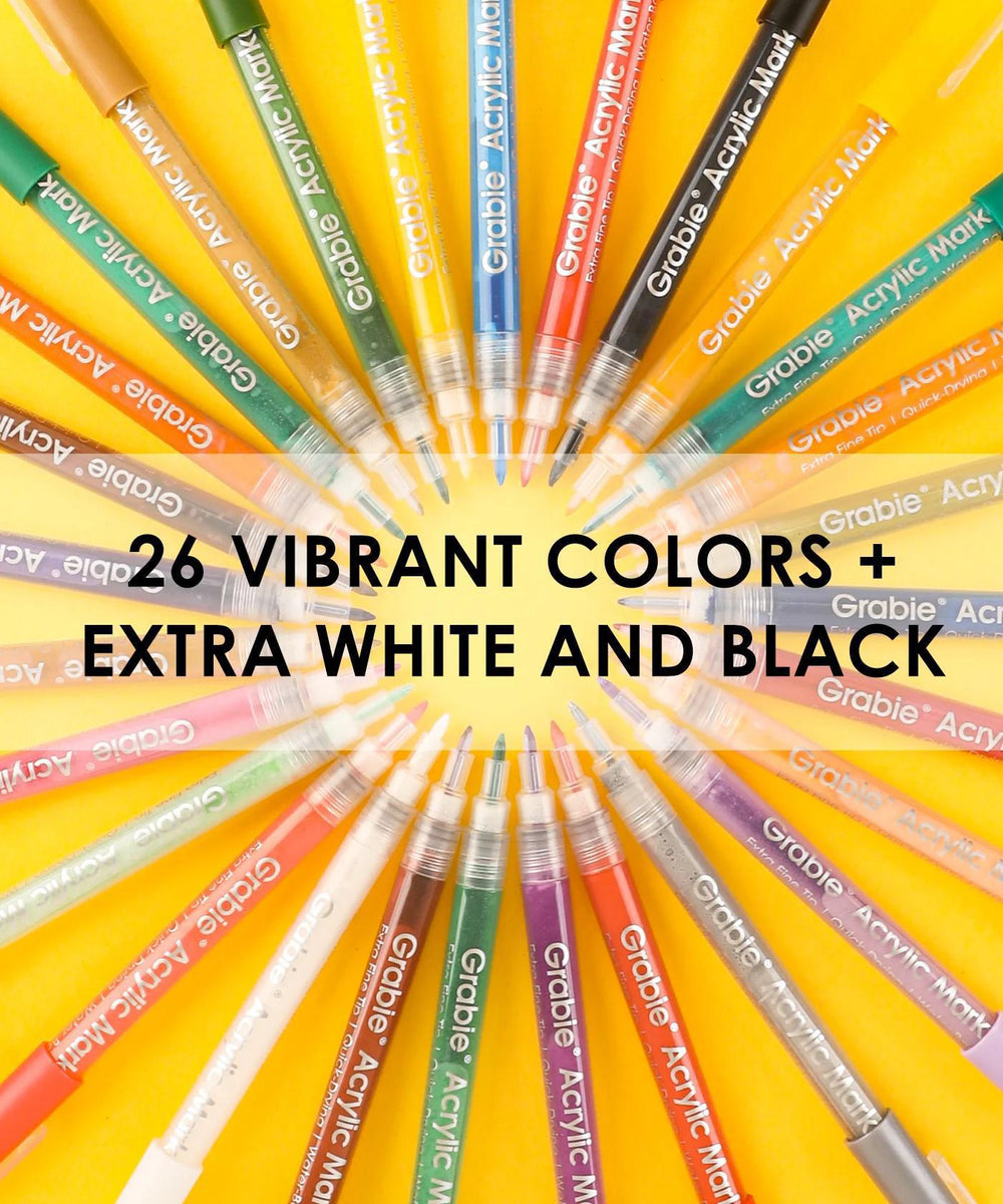Assorted acrylic markers in 26 vibrant colors on a yellow background
