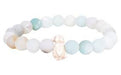 A beaded stretch bracelet featuring light blue, white, and cream-colored round beads, with a central rose gold-toned crystal charm, shown on a plain white background.